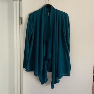 Gorgeous Teal coverup with handkerchief hemline. Size M